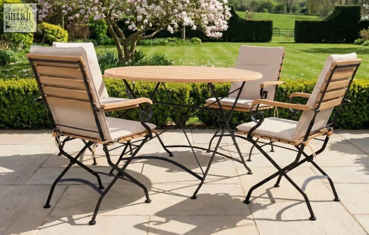 Round 4 seater dining set with grade ab teak top and black wrought iron legs perfect for garden use