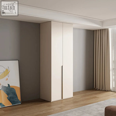 Beige minimalist sid wardrobe with sleek flat-panel doors and slim vertical handles in creamy white finish