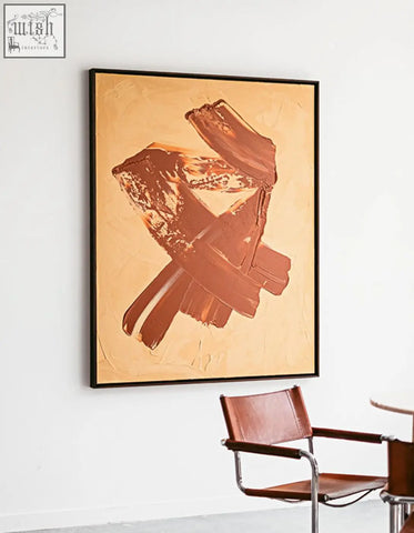 Siegmund wall art painting with bold brown textured brushstrokes on beige background framed in sleek black perfect for wall art shipping cost