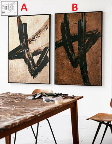 Two siegmund wall art paintings featuring bold black brushstrokes on beige and brown backgrounds in black frames with low shipping cost