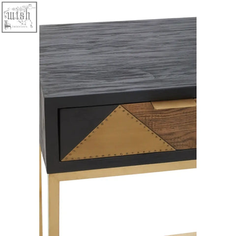 Siena console table with black body gray wood grain top gold console legs and geometric brass leather drawer front