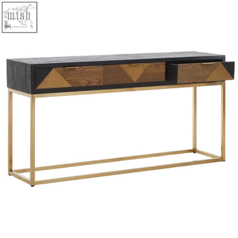 Siena console table with a black and wood-grain top featuring geometric brass inlays and slender gold console legs