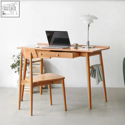 Light-colored ash wood sierra office desk with matching chair and modern white lamp for stylish office desk setup