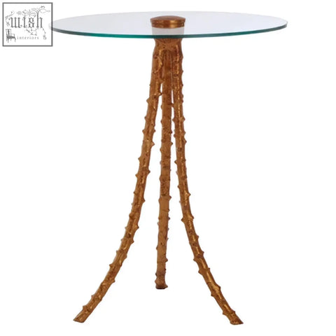 Sika large side table with triple-leg base in warm gold featuring golden bamboo-inspired pedestal and clear glass top