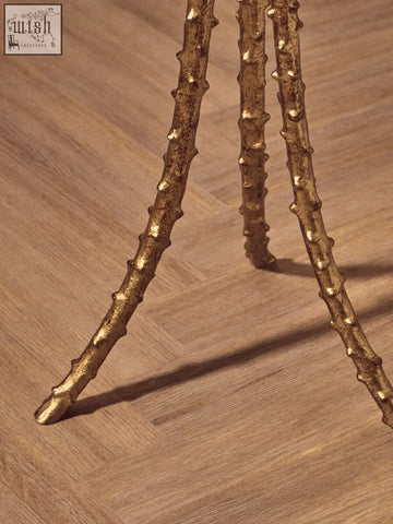 Golden branch-like tripod legs with a textured metallic finish on the sika large side table triple-leg base in warm gold