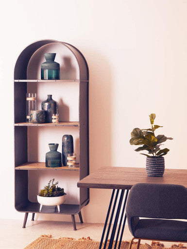 Dark metal arched silas brown planter with wooden shelves holding green and dark ceramic vases on display