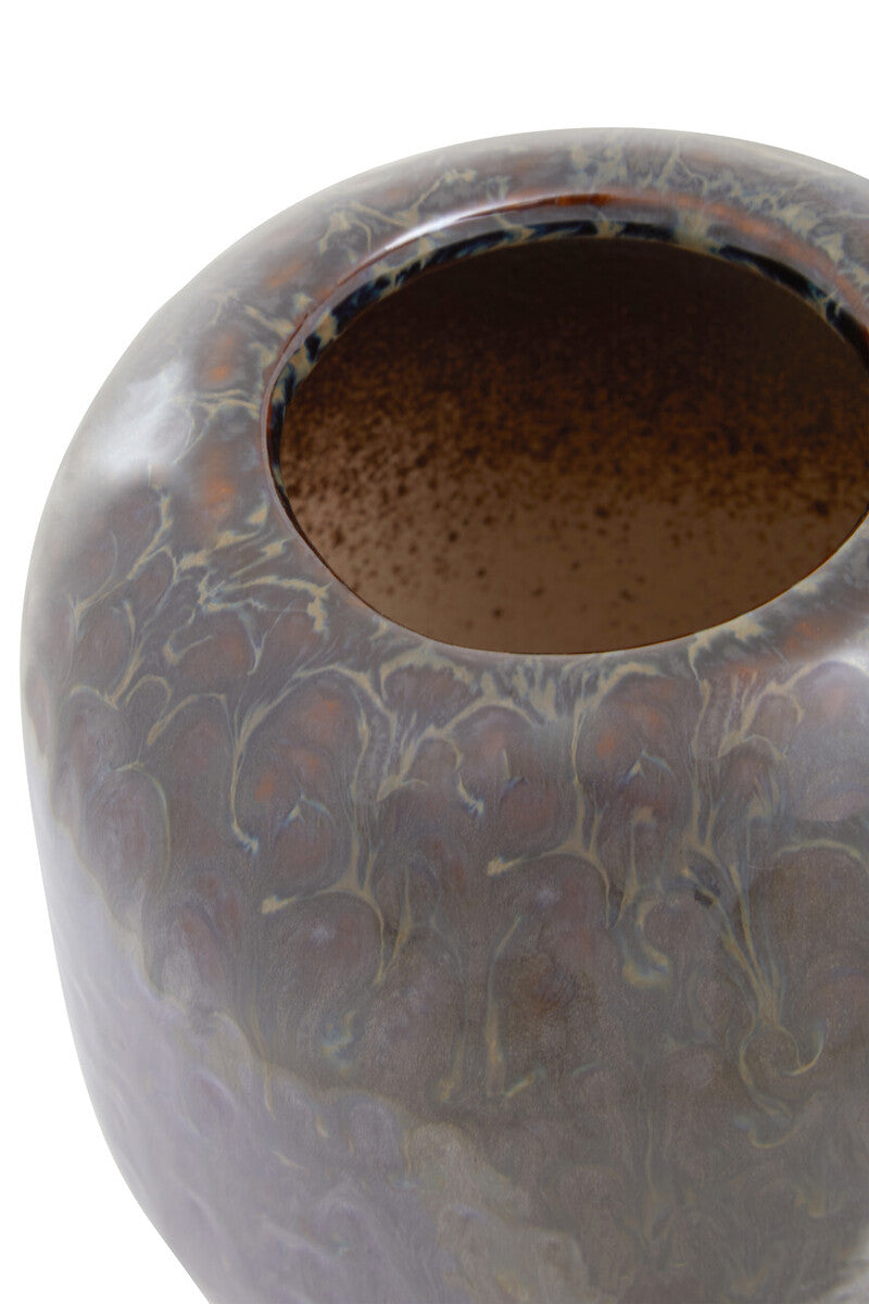 A silas dark blue planter ceramic vase with a glossy marbled surface in shades of brown and gray