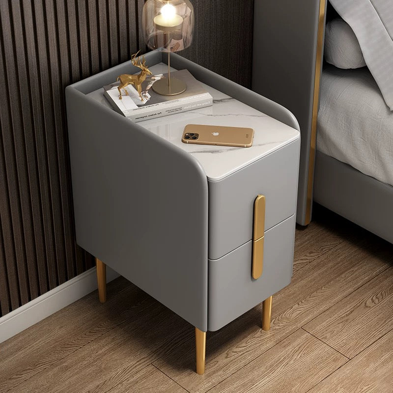 Modern gray Silva bedside table with marble top gold-tone legs and two drawers with sleek vertical handles