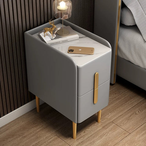 Modern gray Silva bedside table with marble top gold-tone legs and two drawers with sleek vertical handles