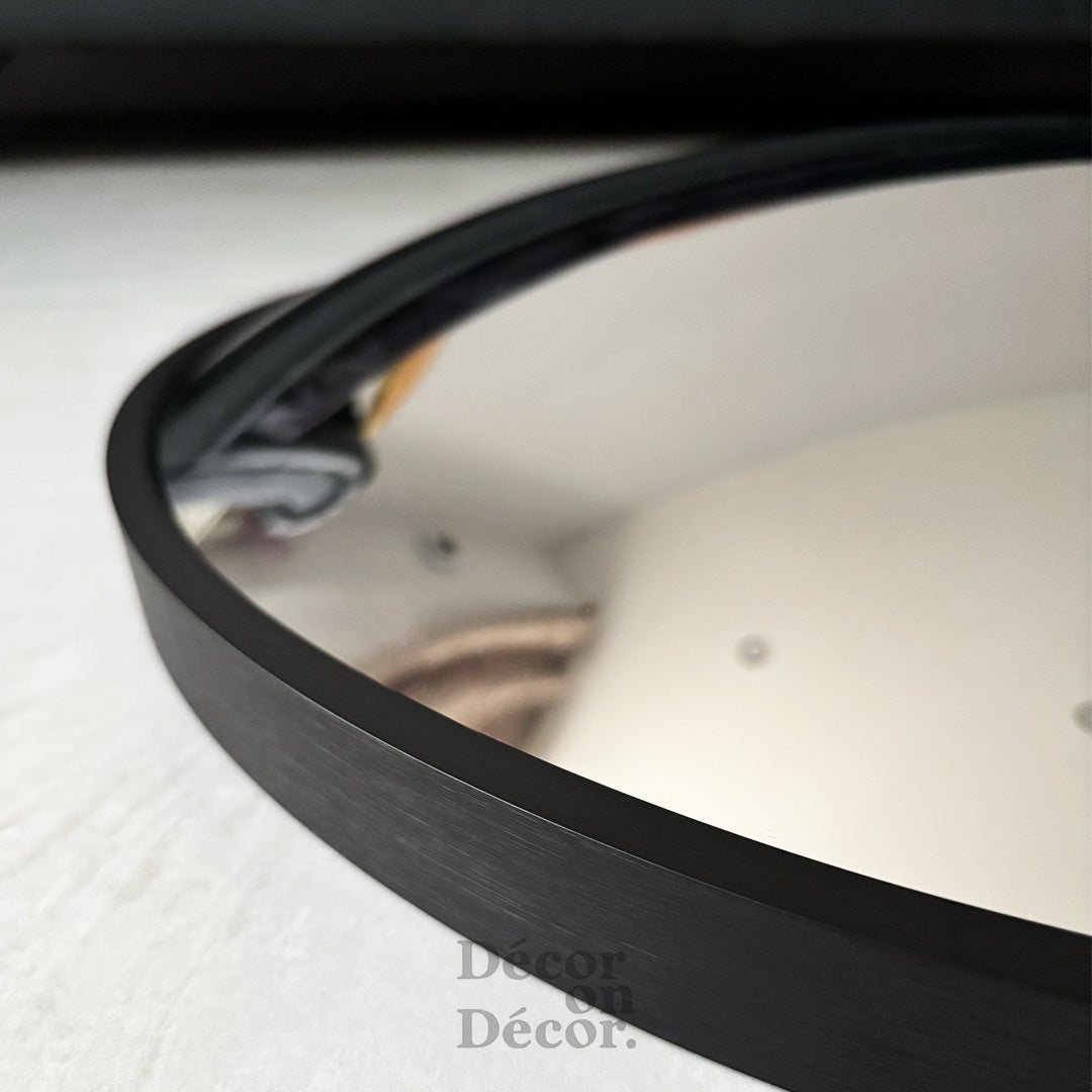 Black frame silver bubble interactive mirror with sleek matte finish and modern black circular design