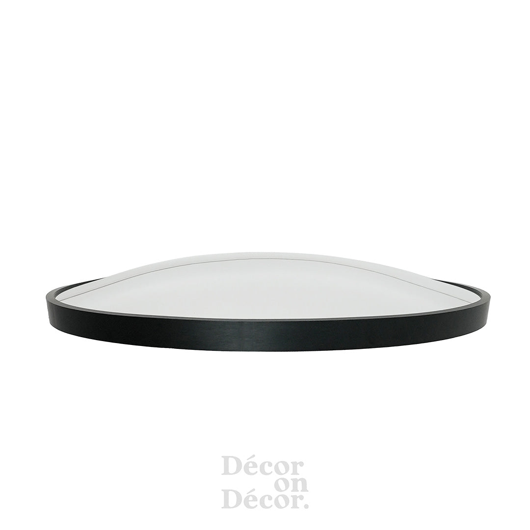 Black framed silver mirror with smooth reflective surface featuring interactive bubble design in oval shape