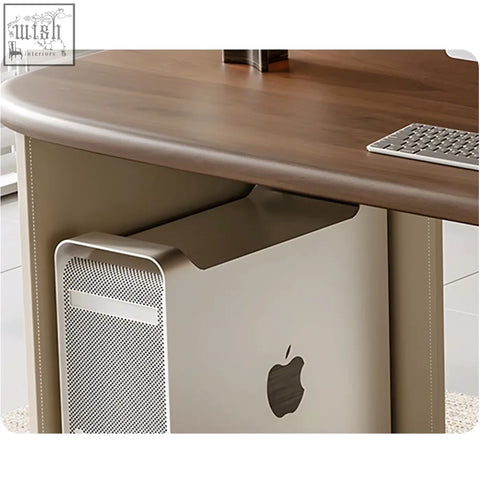 Beige apple mac pro with perforated metal front and black logo on solid wood simao office desk with storage drawers