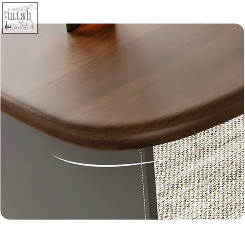 Dark brown solid wood tabletop with smooth polished finish and rounded edge on simao office desk with storage drawers