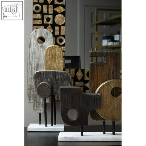 Abstract wooden metal sculpture with textured earthy tones and geometric cutouts on marble base simbolo small assorted