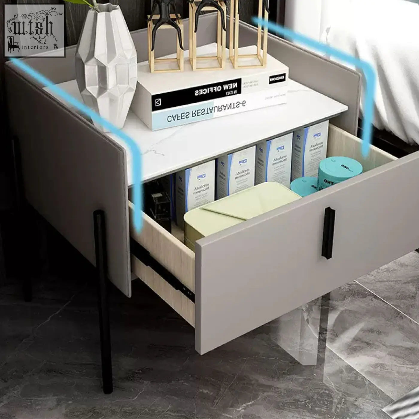 Modern gray simpdiy bedside table with white marble top and black metal legs showing open drawer with toiletries