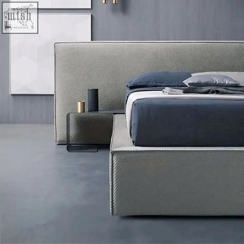Modern gray simupo bed with textured fabric headboard and matching base featuring hidden storage options