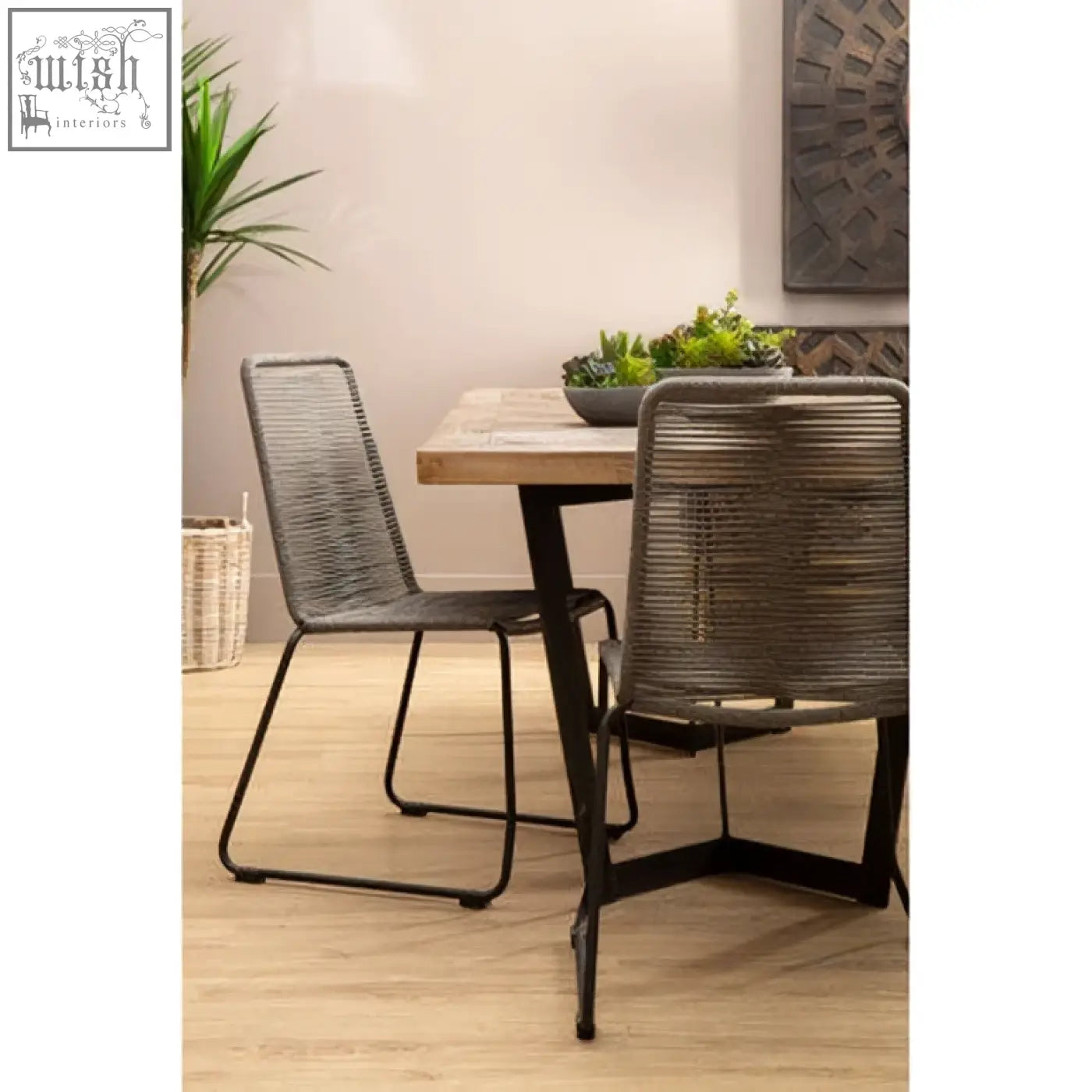 Sisal grey rope chair featuring a grey rope seat with black iron frame legs for stylish dining room seating