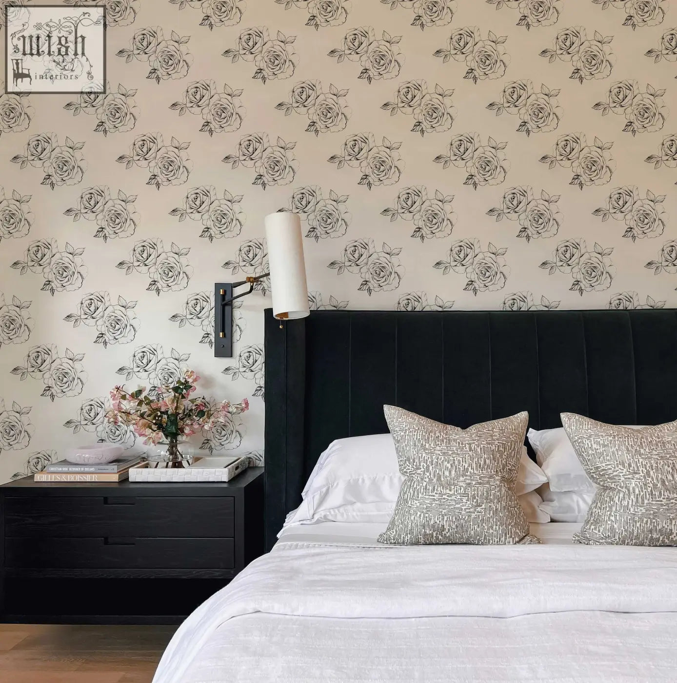 Black tufted velvet headboard with sleek vertical stitching complements sketch rose peel and stick wallpaper for living space decor