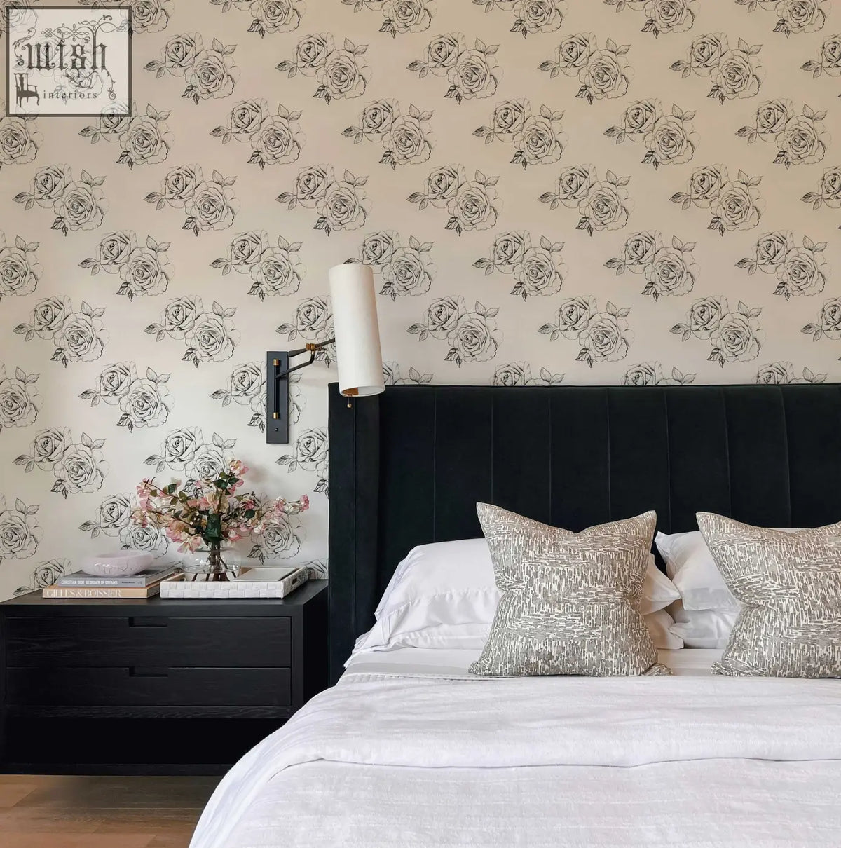 Black tufted velvet headboard with sleek vertical stitching complements sketch rose peel and stick wallpaper for living space decor