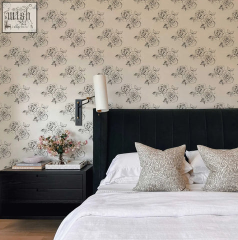 Black tufted velvet headboard with sleek vertical stitching complements sketch rose peel and stick wallpaper for living space decor