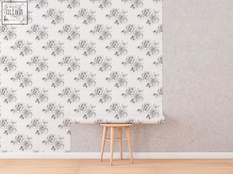 Roll of white traditional paper wallpaper with black line-art roses pattern perfect for living space ordering process