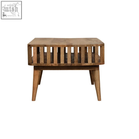 Rustic slatted oak-ish coffee table with open shelf and tapered legs made from solid mango wood