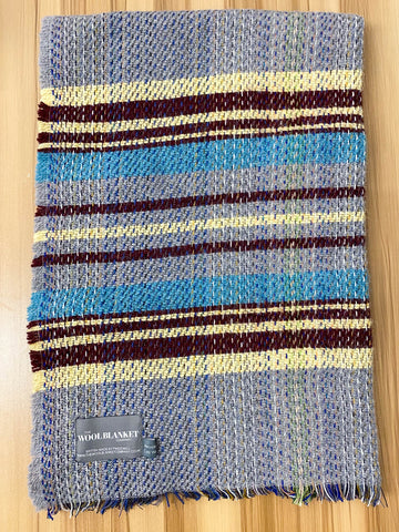 A cozy small checked random recycled wool blanket with handwoven blue maroon and cream stripes