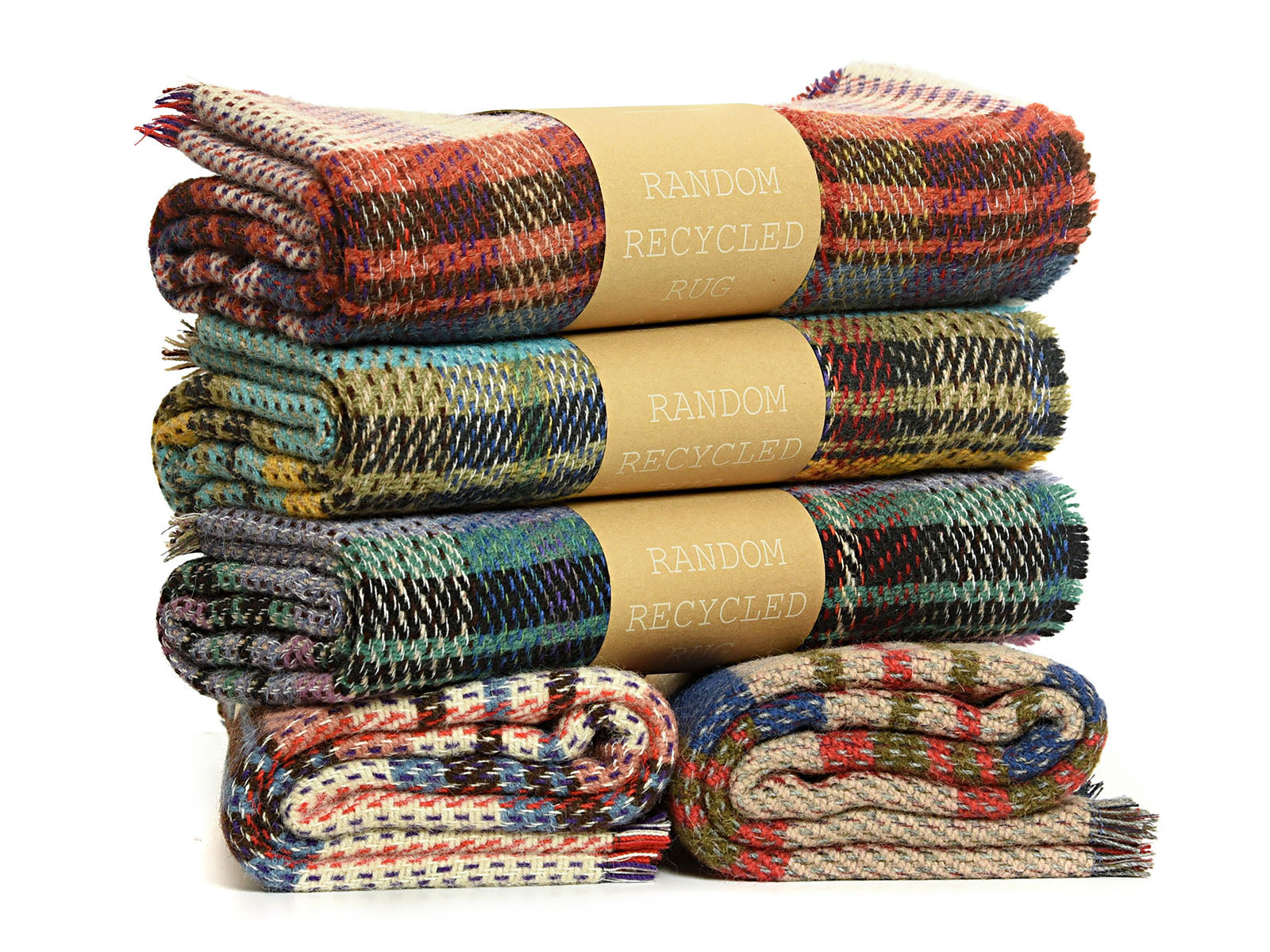 Stacked small checked random recycled wool blankets with colorful plaid patterns and recycled wool labels