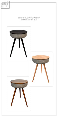 Modern smart coffee table with textured gray woven body and black wood top on tapered legs