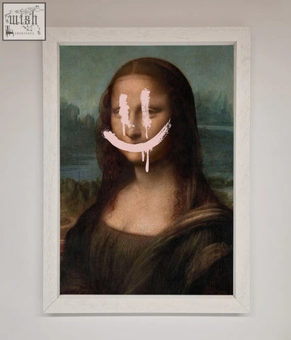 A white-framed smiley mona framed poster featuring a modified mona lisa with a pink smiley face painted over her features