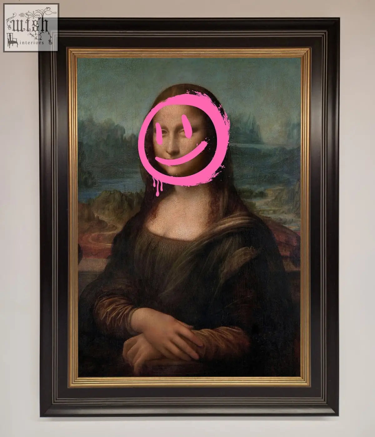 A smiley mona lisa framed print featuring a bright pink smiley face overlay on the classic painting in a black frame