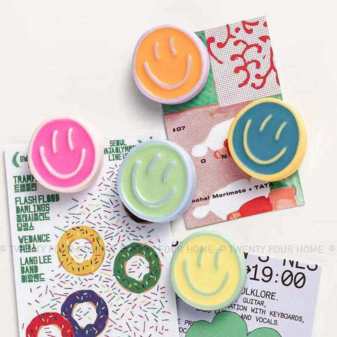 Colorful smiling glow fridge magnet pack with pastel and vibrant glossy plastic smiley face phone stand holders