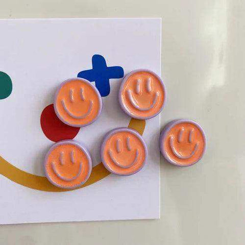 Orange smiling glow fridge magnet pack with smiley face buttons and light purple border perfect for your fridge