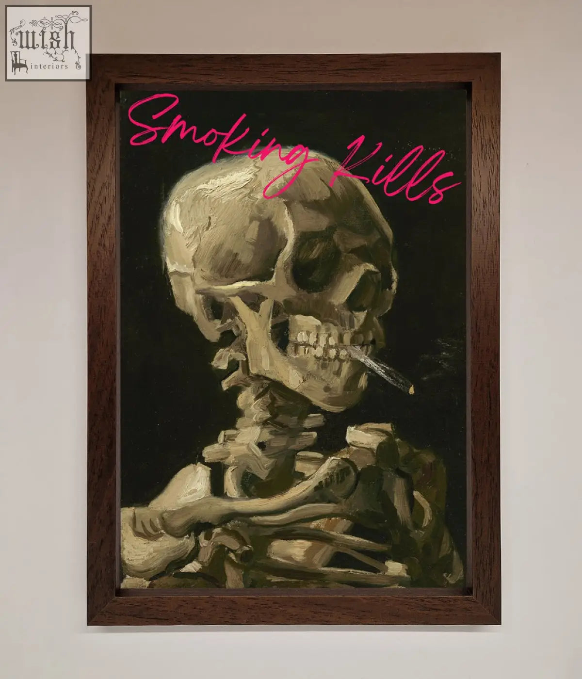 A smoking kills framed wall art featuring a beige skull with a cigarette on a dark background with pink text