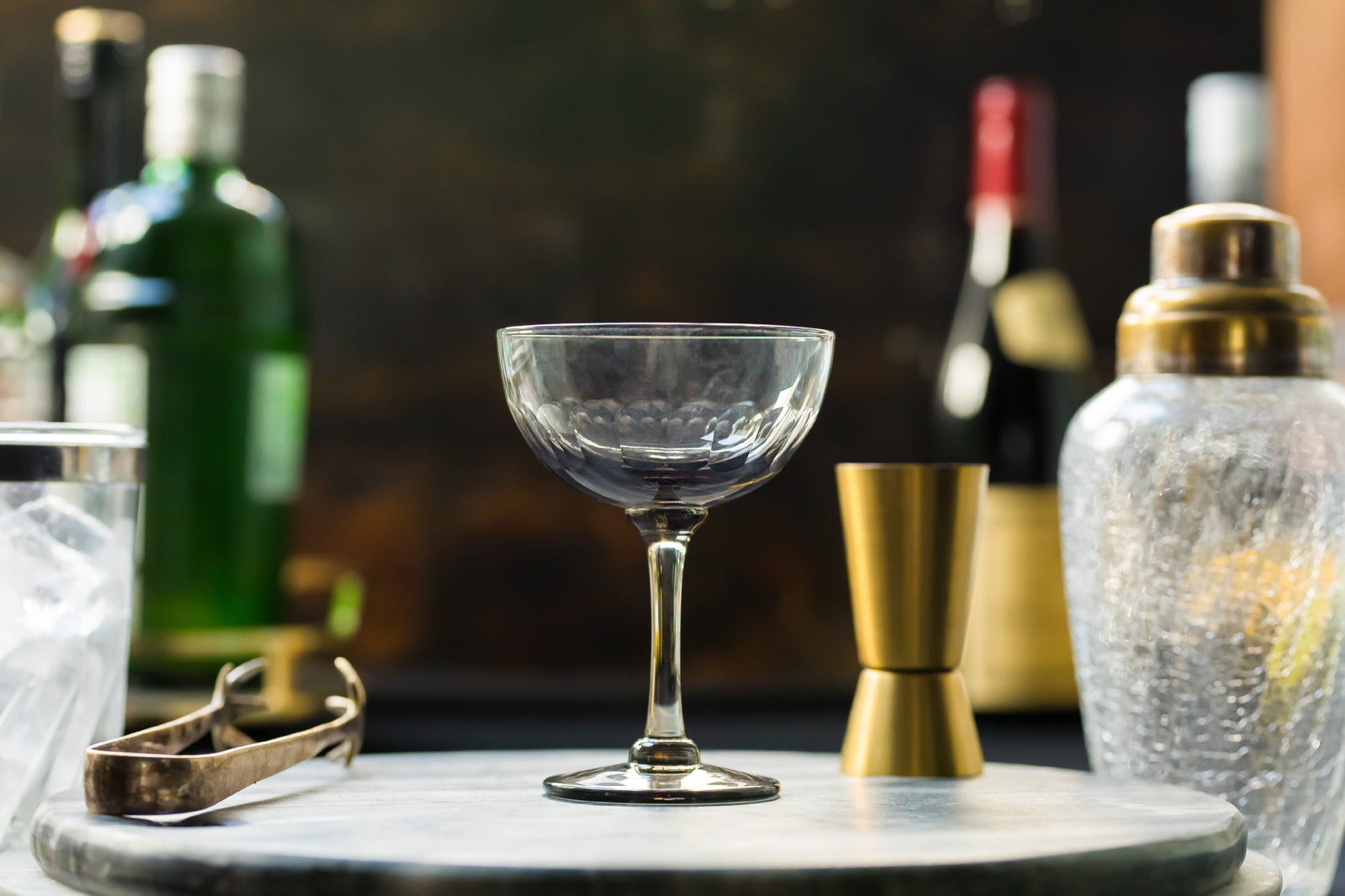four smoky crystal champagne saucers with lens design