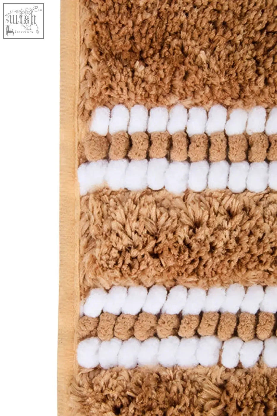 Soak large camel bath mat with tan and white stripes and plush textured surface for cozy bathroom use