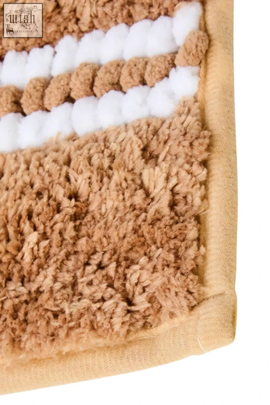 Tan and white striped plush soak large camel bath mat with soft textured surface for cozy bathroom use