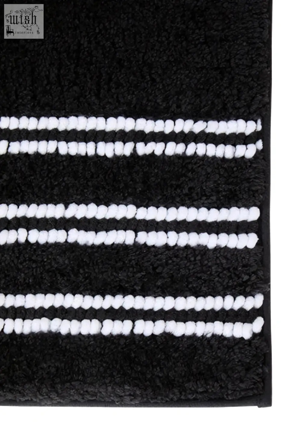 Large charcoal grey bath mat with plush black fabric and three white textured yarn stripes for cozy bathroom use