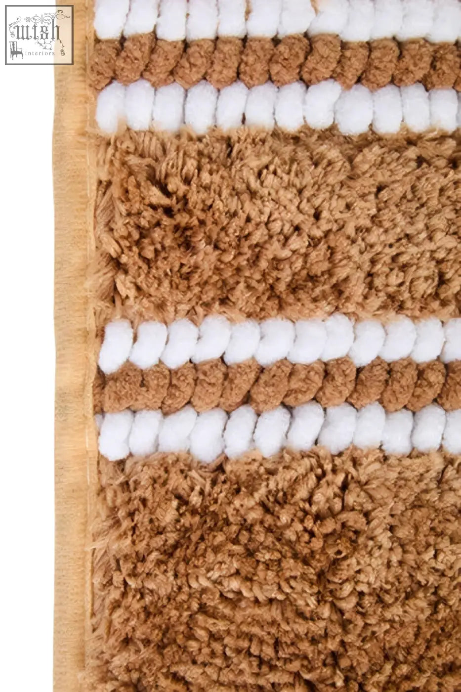 Tan and white striped plush small camel bath mat with a textured surface perfect for bathroom use