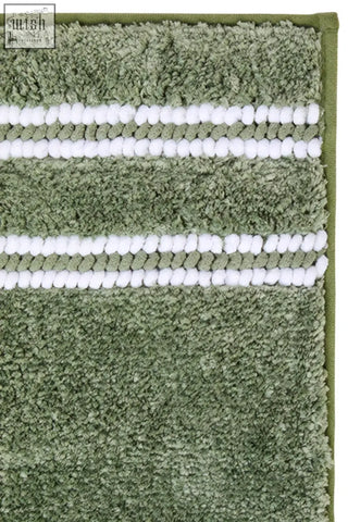 Olive green plush bath mat with white pom-pom stripes perfect as a soft sage green bath mat for any bathroom