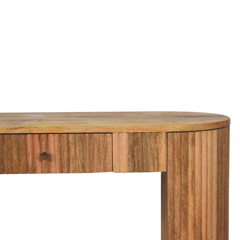 A warm-toned wooden soba straight console table with curved top and vertical grooves along the sides
