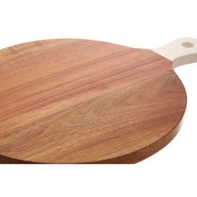 Round wooden serving board with a smooth light brown surface and cream handle from socorro chopping series