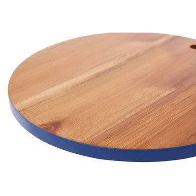 Round acacia chopping and serving board with a blue painted edge and natural wood finish