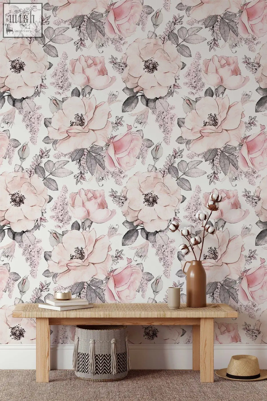 A rustic wooden bench with woven rattan top and basket under against soft pink abstract roses wallpaper for living space