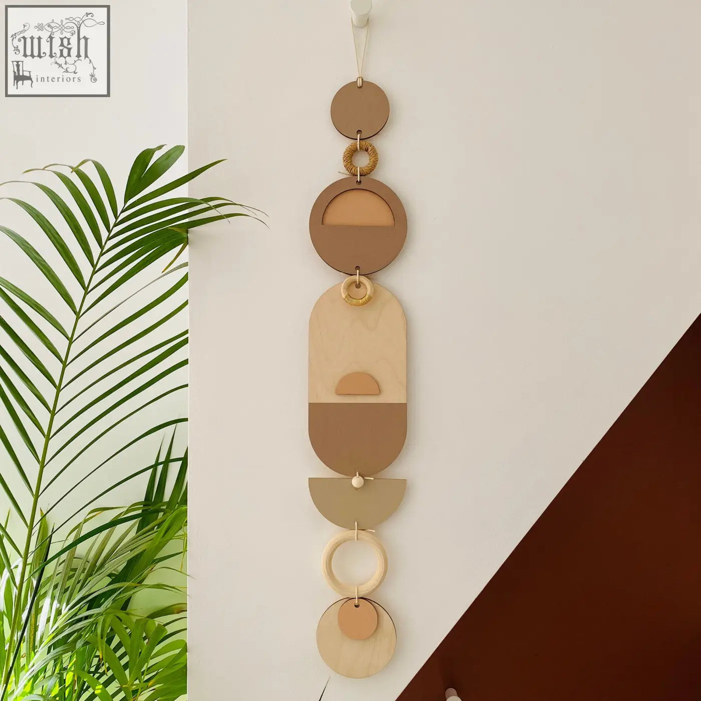 Minimalist modern wall art with layered geometric shapes in soft pink and natural wood texture for neutral home decor