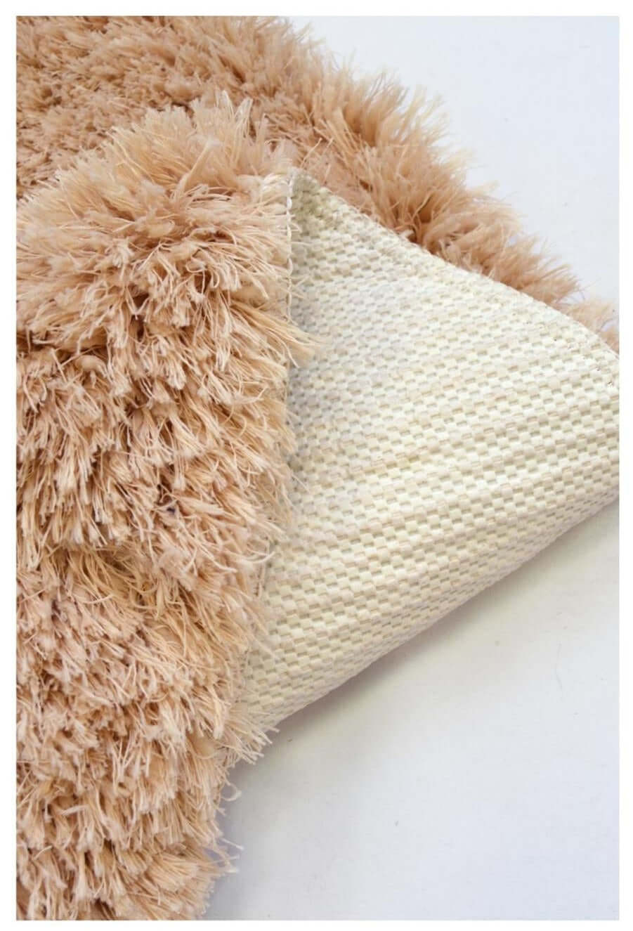 Soft washable beige shaggy rug with plush fluffy texture and woven backing in product sa-02