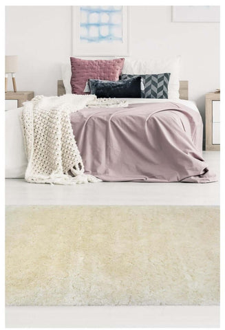 Soft washable ivory shaggy rug with cream-colored plush and a soft textured surface perfect for cozy spaces