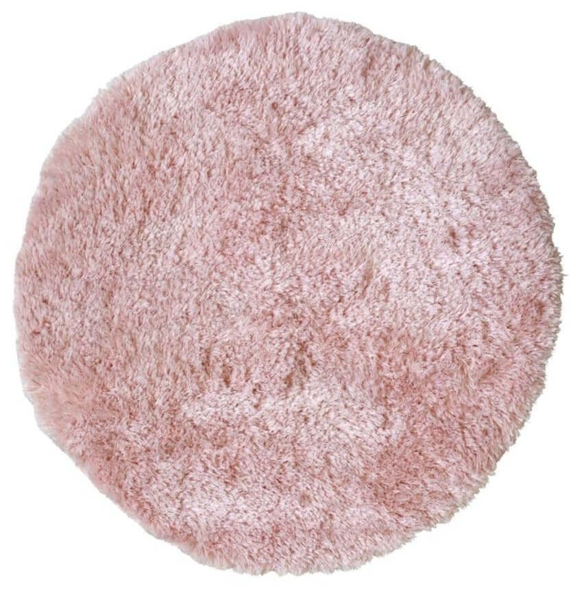 A soft washable pink shaggy rug with a plush round shape and fluffy texture perfect for cozy spaces