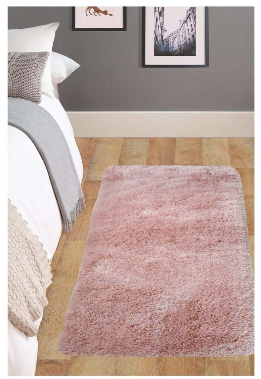Soft washable pink shaggy rug sa07 with a plush texture lying on a wooden floor