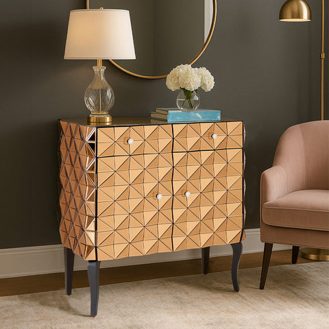 Gold-toned soho copper finish cabinet with geometric mirrored triangular facets and dark legs in a copper finish cabinet design